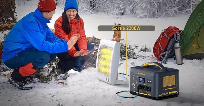 VTOMAN Jump 2200 utilisée dans la neige par deux personnes en tenue d'hiver, près d'une tente
